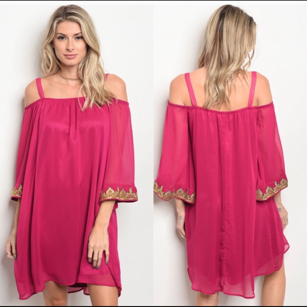 Magenta off the shoulder dress.